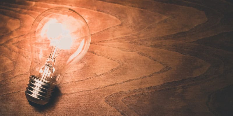 Lightbulb on table image